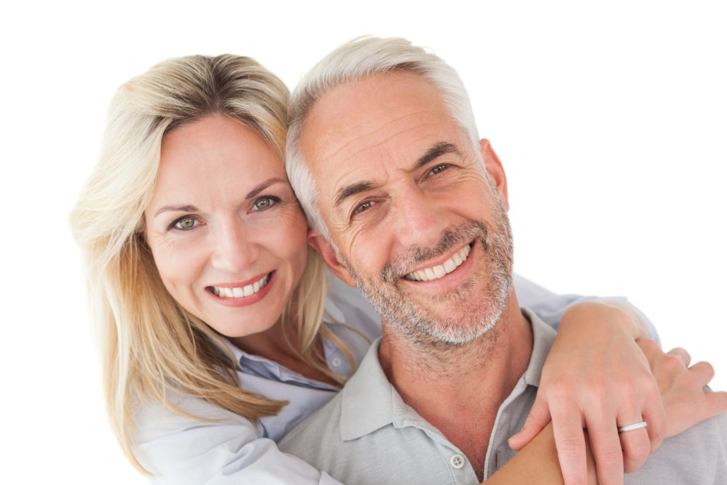 Close up portrait of happy mature couple over white background